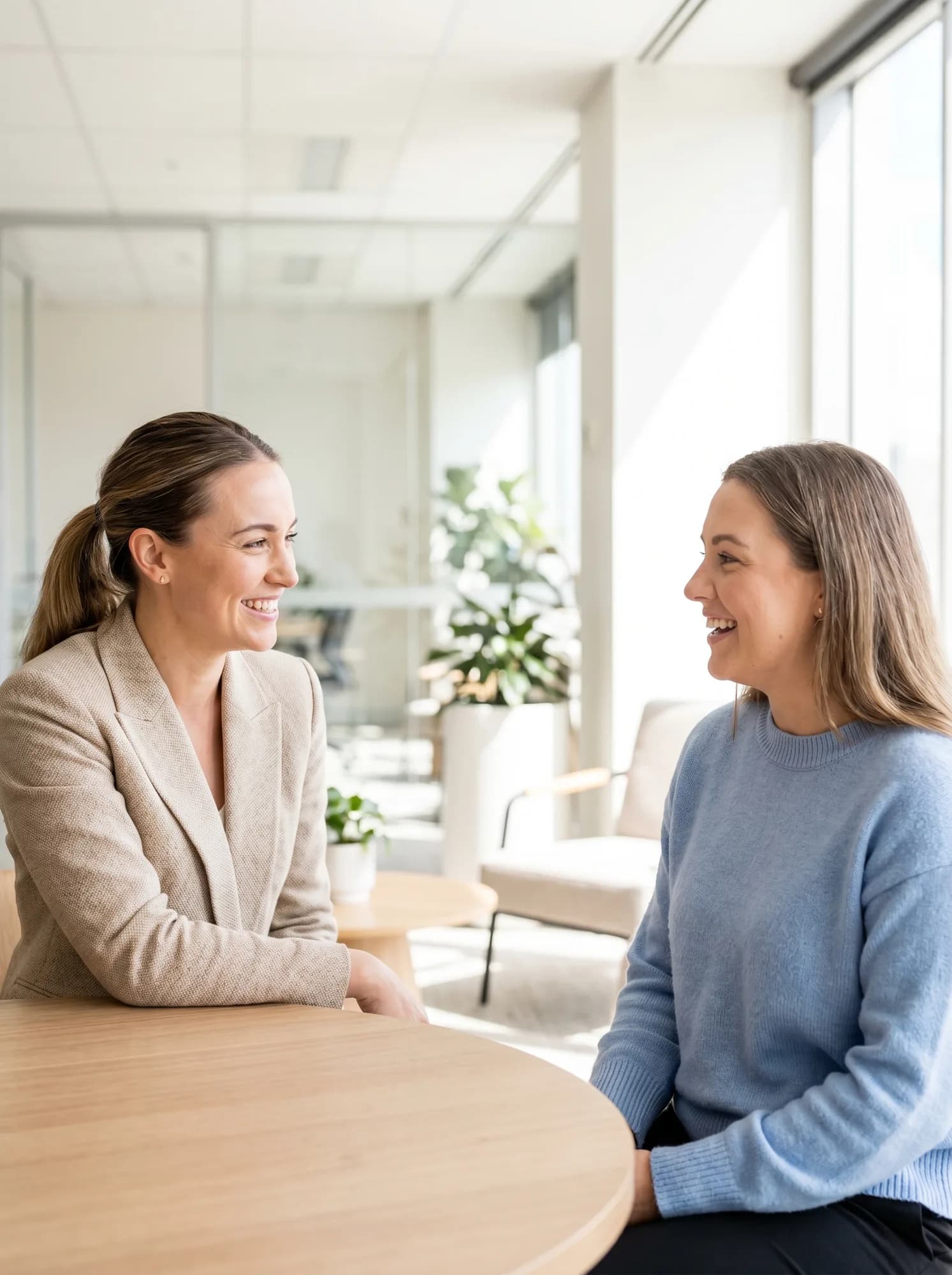 A solicitor at Emerson Legal in warm conversation with a client